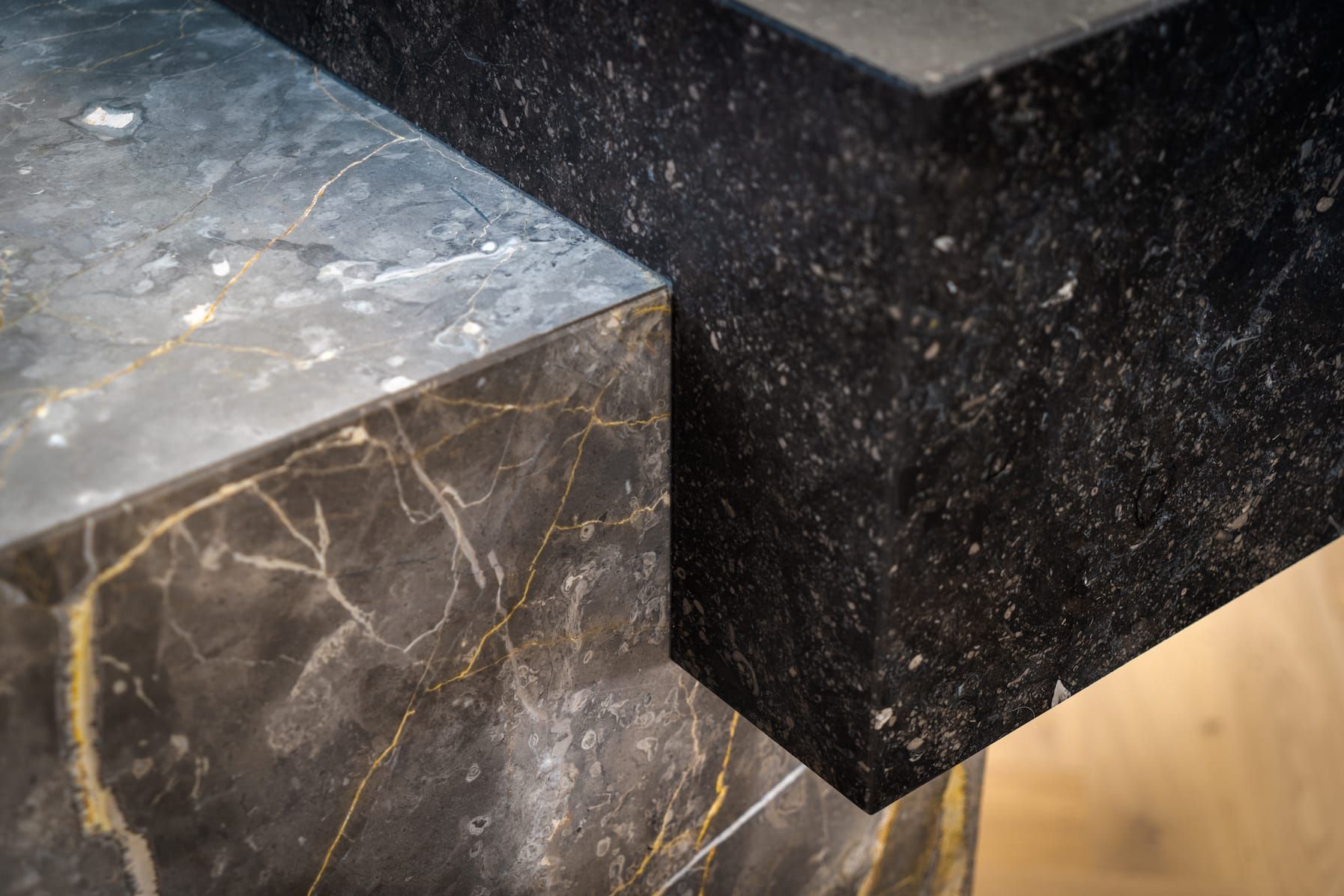 Corner detail of veined stone and dark textured stone blocks in Interstellar